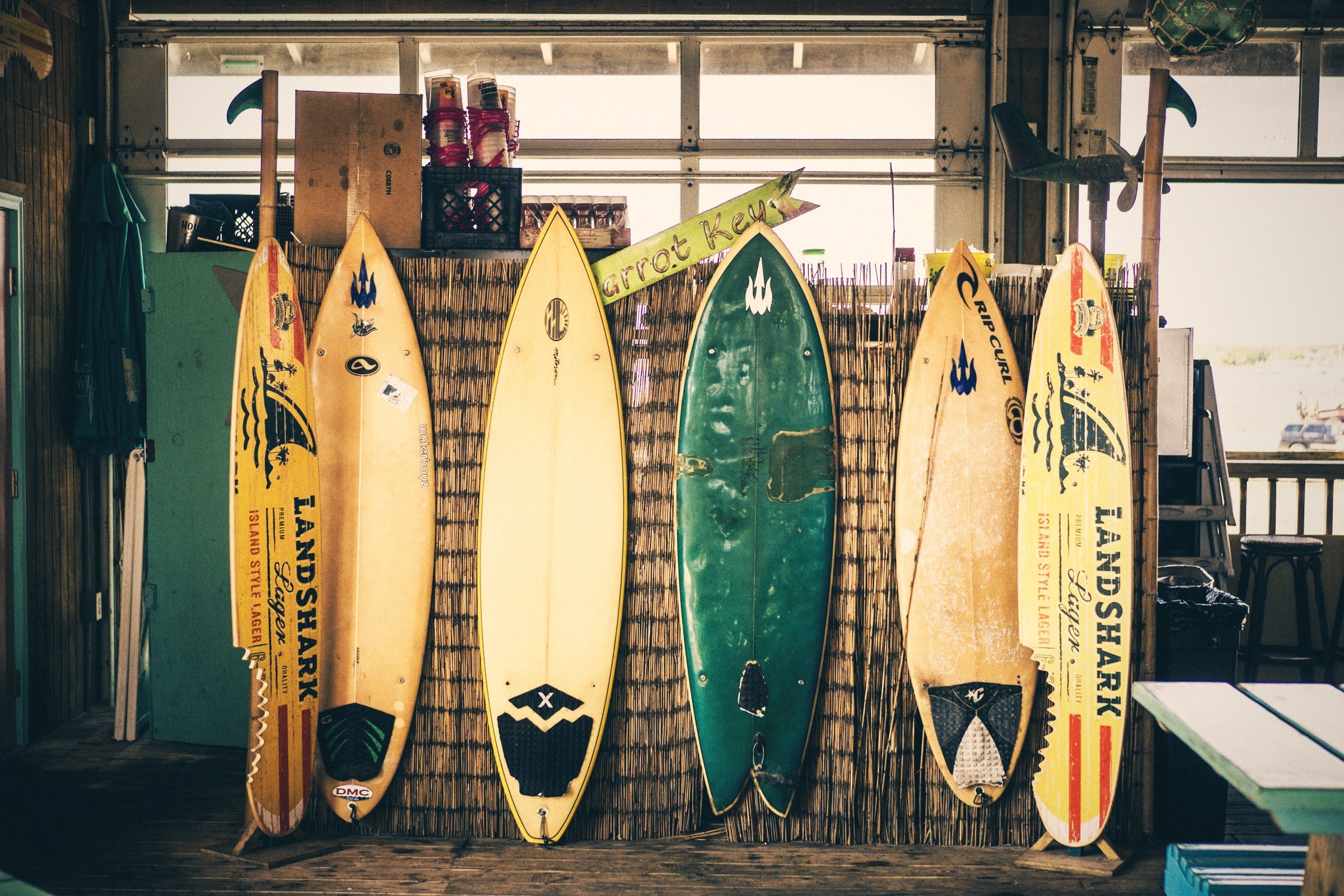 Row of colourful vintage surfboards