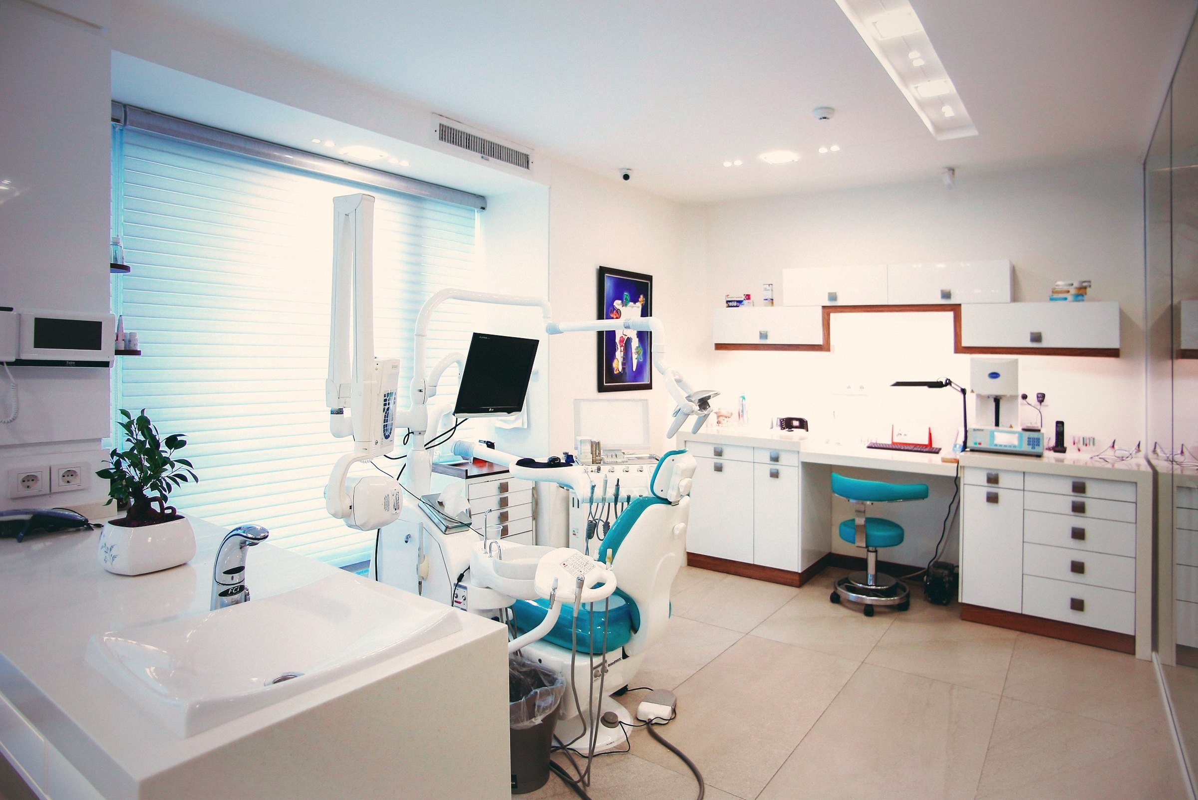 Bright modern dental clinic room with treatment chair