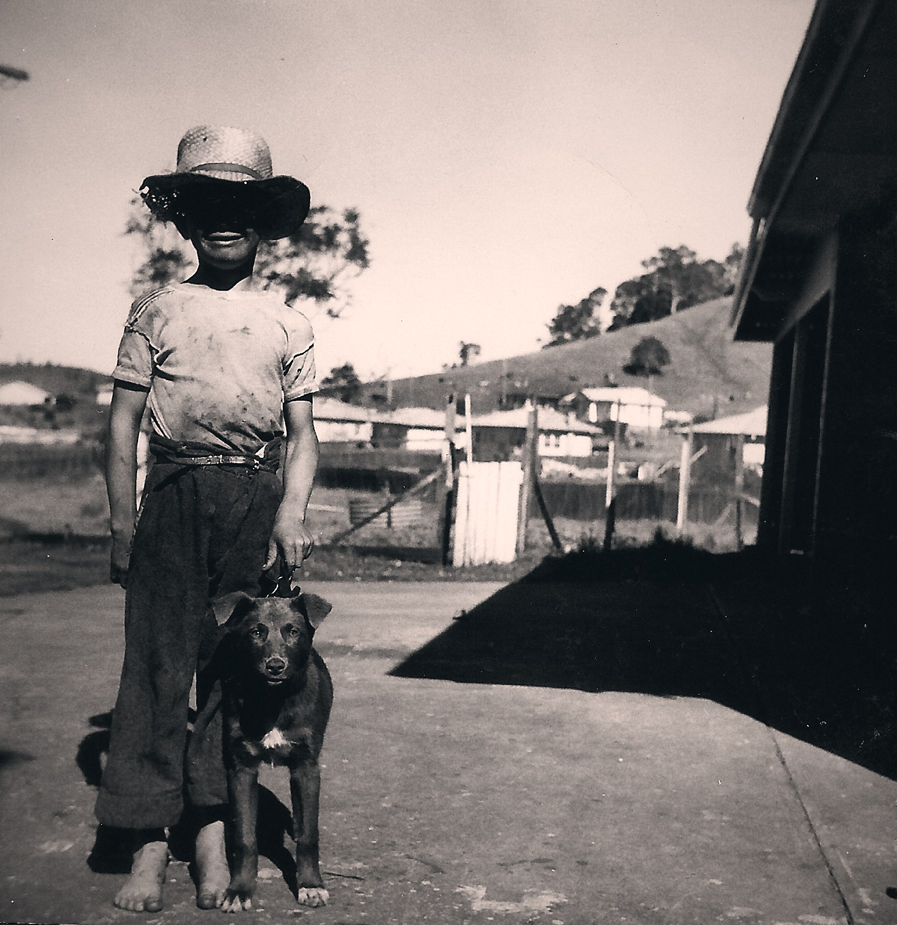Deon's dad Mark Wade as a boy around 1962 in Lismore, grubby from play, with his dog