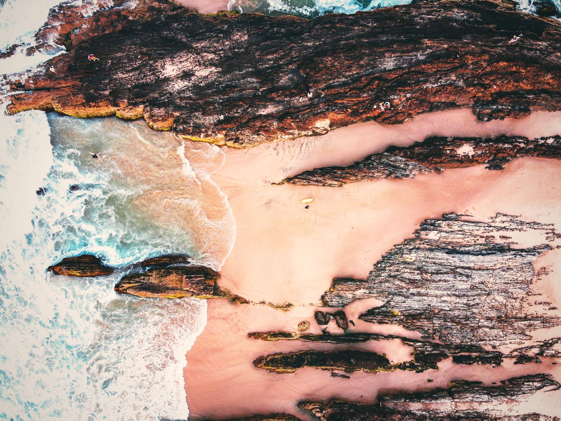 Snapper Rocks at Coolangatta from the air, teal water over rocky reef