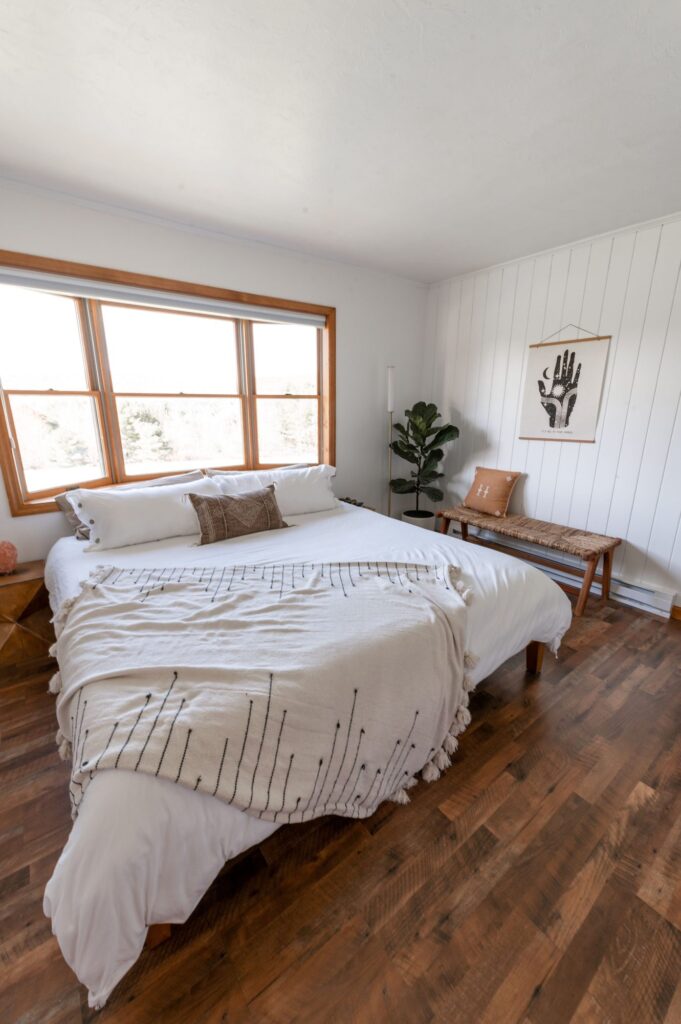 Calm white bedroom with timber floors after a home clean, Palm Beach, Gold Coast, The Old School Cleaning Co.